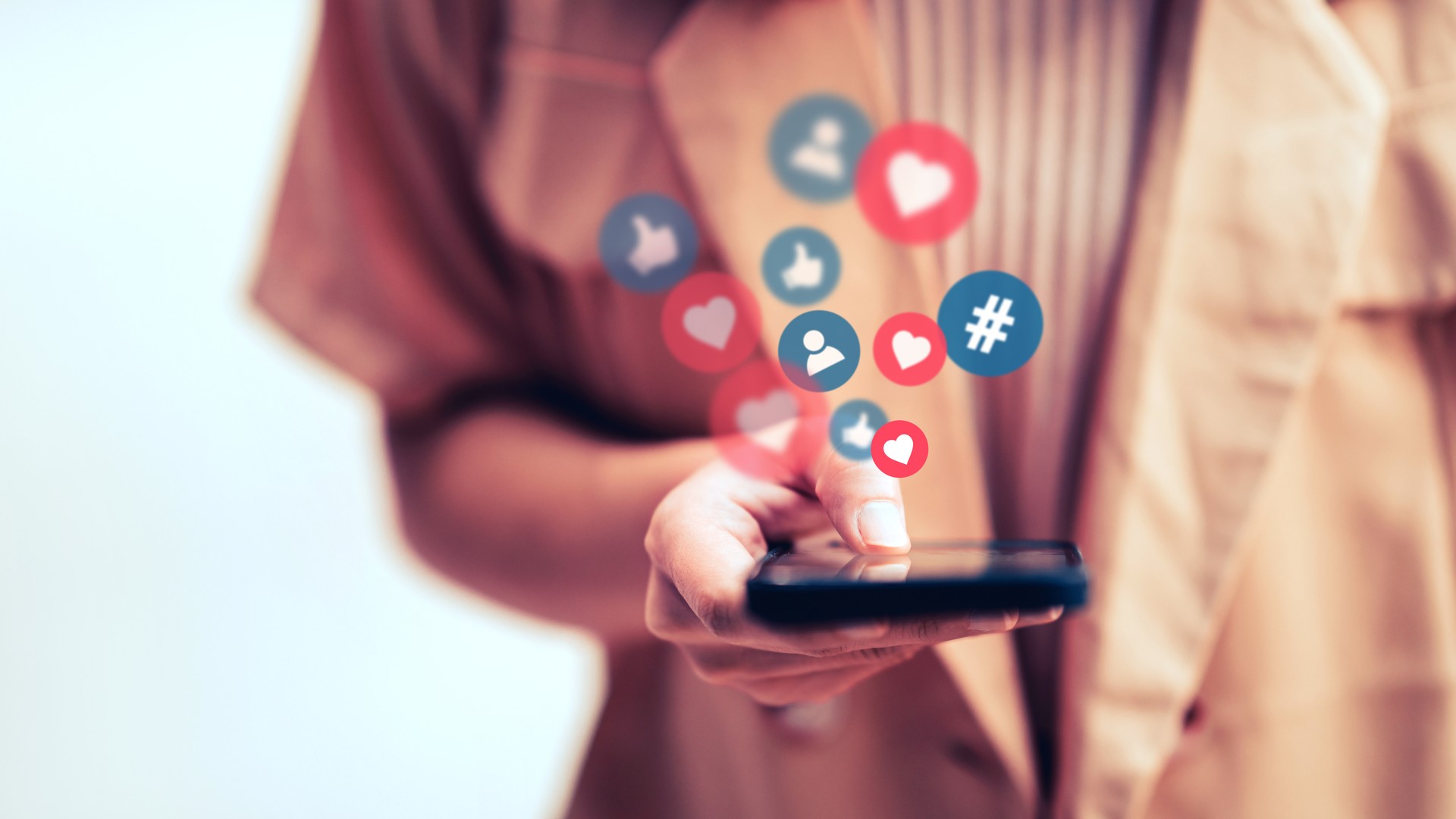 Woman using a social media marketing concept on mobile smartphone with notification icons.